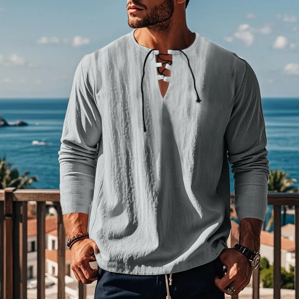 A man wearing a loose-fit solid colour cotton linen blend casual shirt.