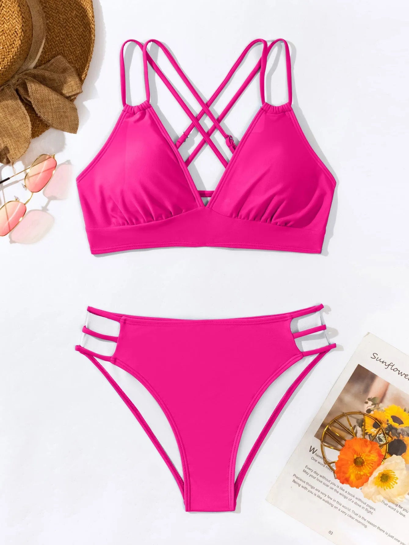 Women's black halter neck bikini swimsuit with V-neck top and split shorts on mannequin