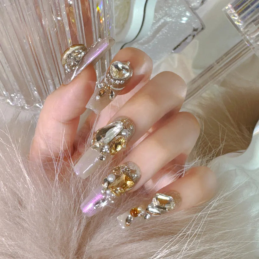 False nail patches with rhinestone decoration on card paper packaging with application tools