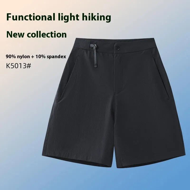 Men's solid colour quick-dry sports shorts with elastic construction for running and climbing.