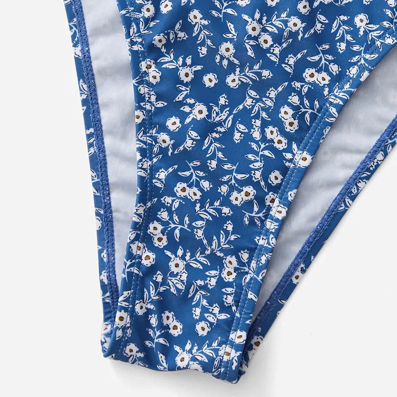 Blue polyester three-piece swimsuit set with separate top and shorts
