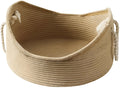 Wicker cat basket bed with a built-in corrugated cardboard scratching panel.
