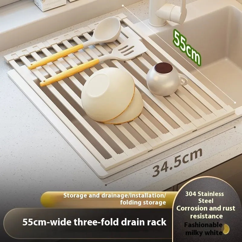 Milky white foldable stainless steel kitchen draining rack next to a sink.