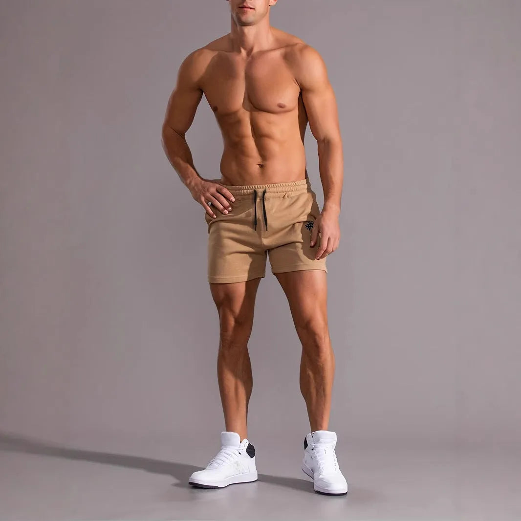 Men's khaki coconut print sports shorts with straight leg cut and elastic waistband