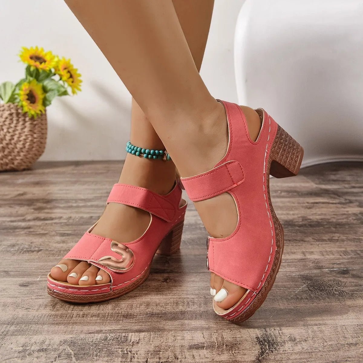 Women's light brown flat Roman sandals with a Velcro strap fastening and round toe.