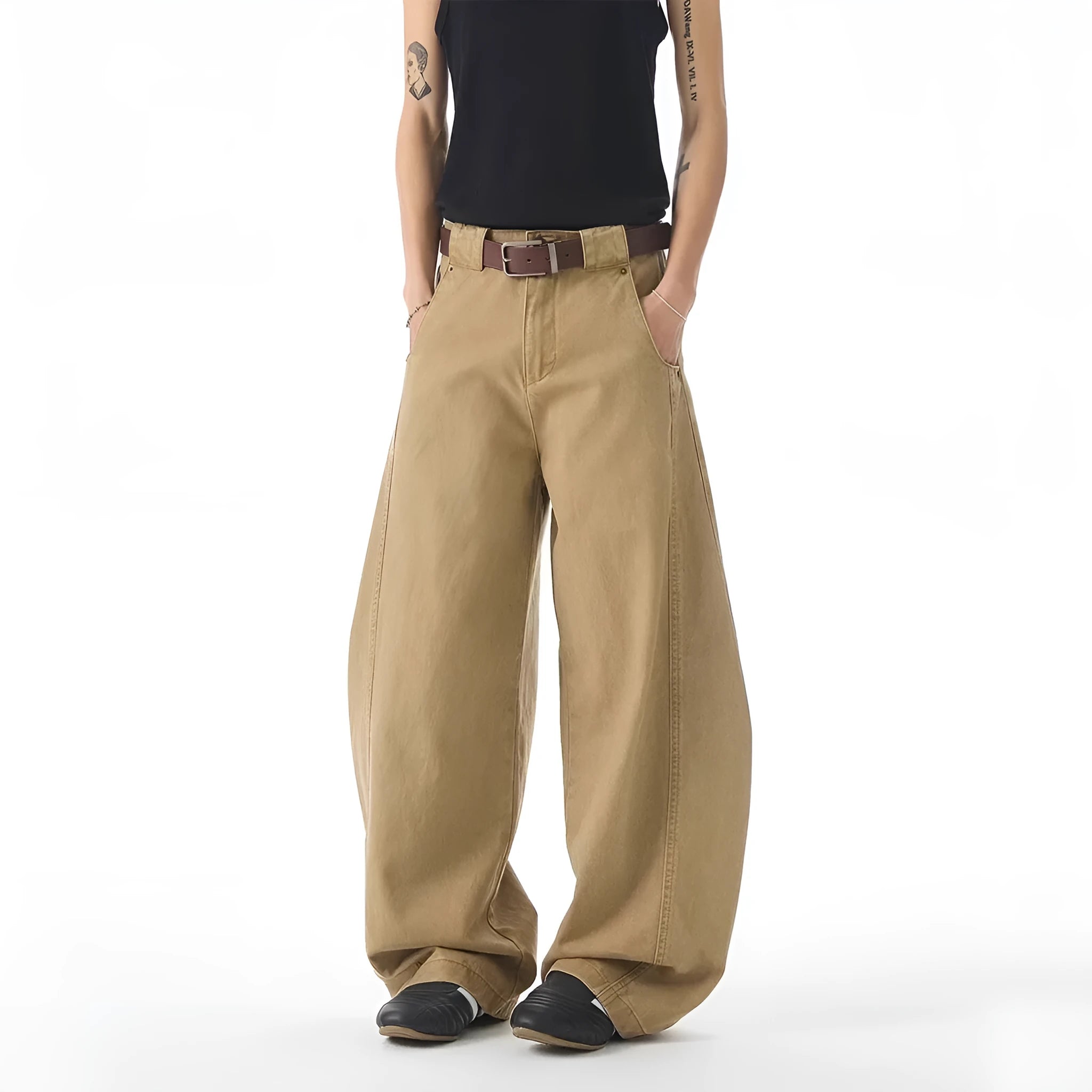 Brown men's loose-fit denim jeans with a straight leg and button fly on a neutral background.