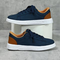 Platform skateboard sneakers in beige brown with cross strap and rubber sole