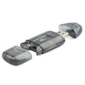 Transparent plastic USB card reader with LED lighting on computer desk