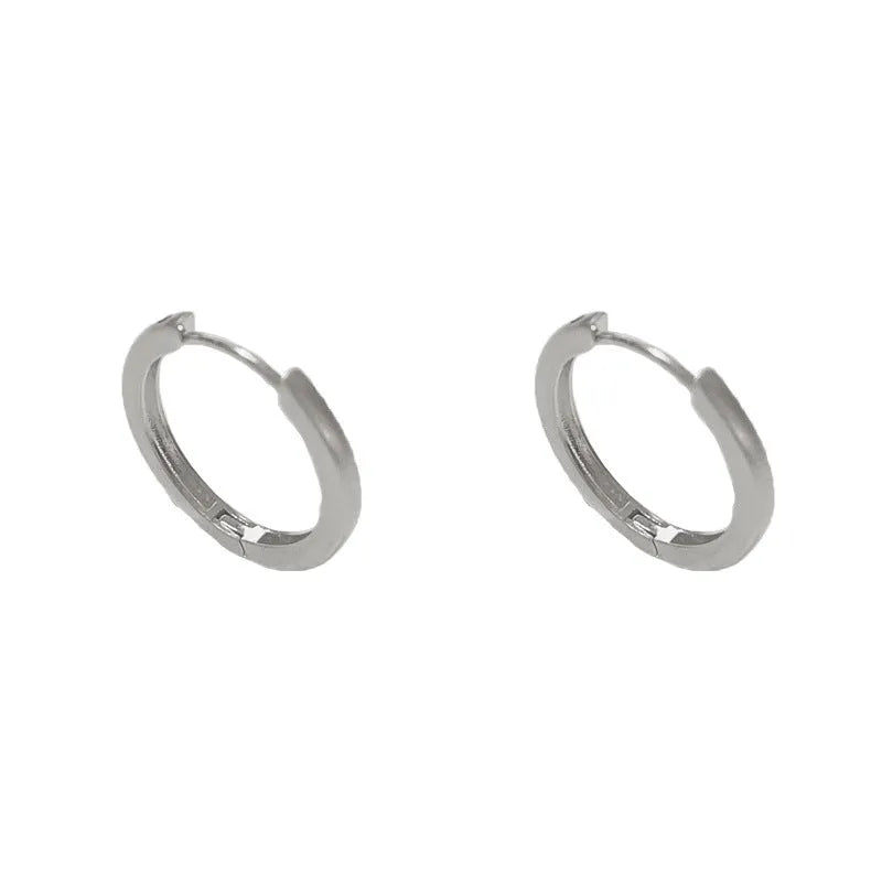 Women's geometric ear clips with round eyelet design in gold plating on copper