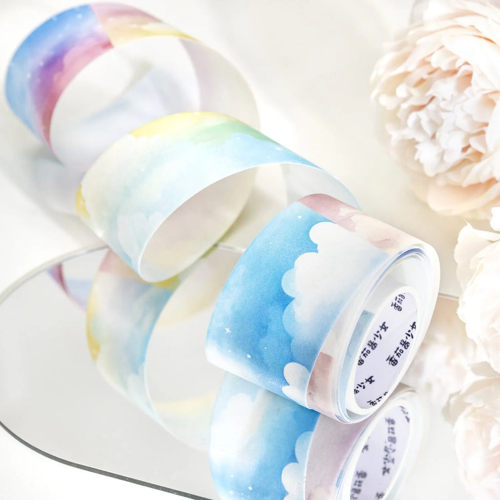 Japanese paper washi tape roll with sky theme designs including clouds, sun and nebula patterns