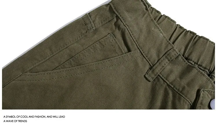 Women's loose-fit cropped pants in micro-elastic fabric showing apricot colour with wide-leg design