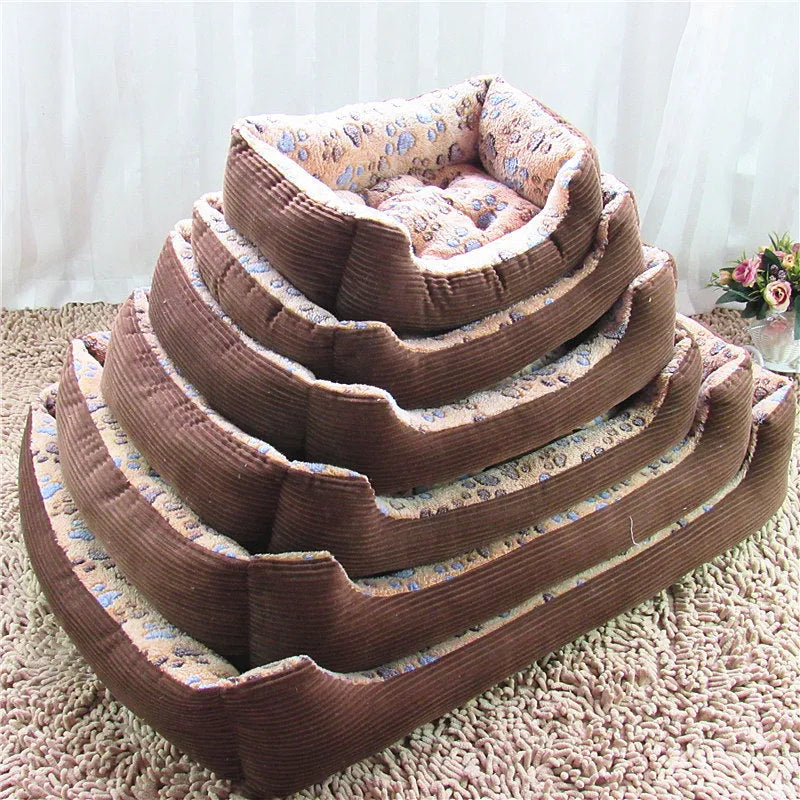 Beige plush bolster dog bed for a small dog, showing raised edges and soft fabric.