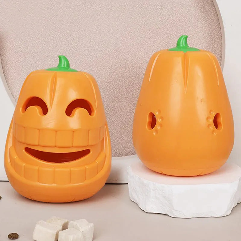 Orange Halloween pumpkin shaped dog chew toy with a treat dispensing funnel.