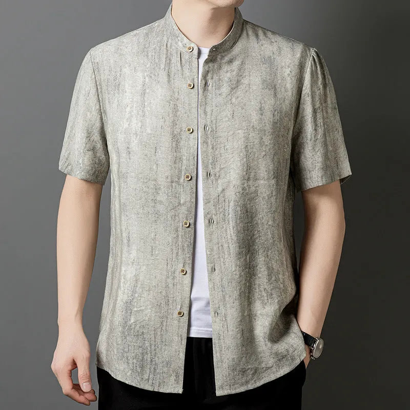 Men's loose grey linen cardigan shirt with a stand collar on a hanger.
