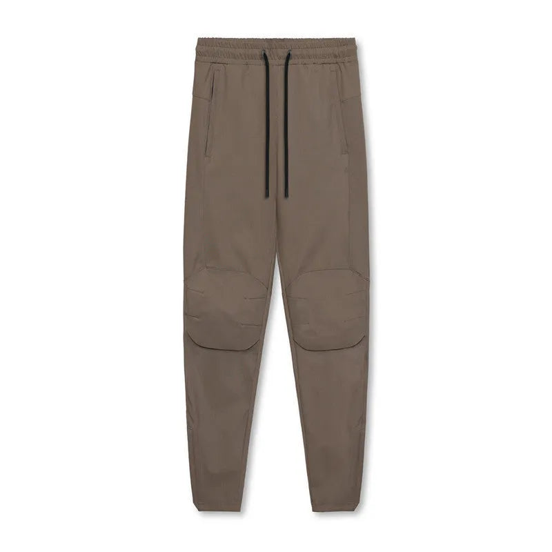 Men's loose grey quick-dry fitness trousers with ankle-tied cuffs for running and gym workouts