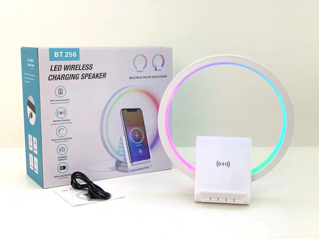 White rectangular Bluetooth speaker with wireless charging pad and ambient lighting