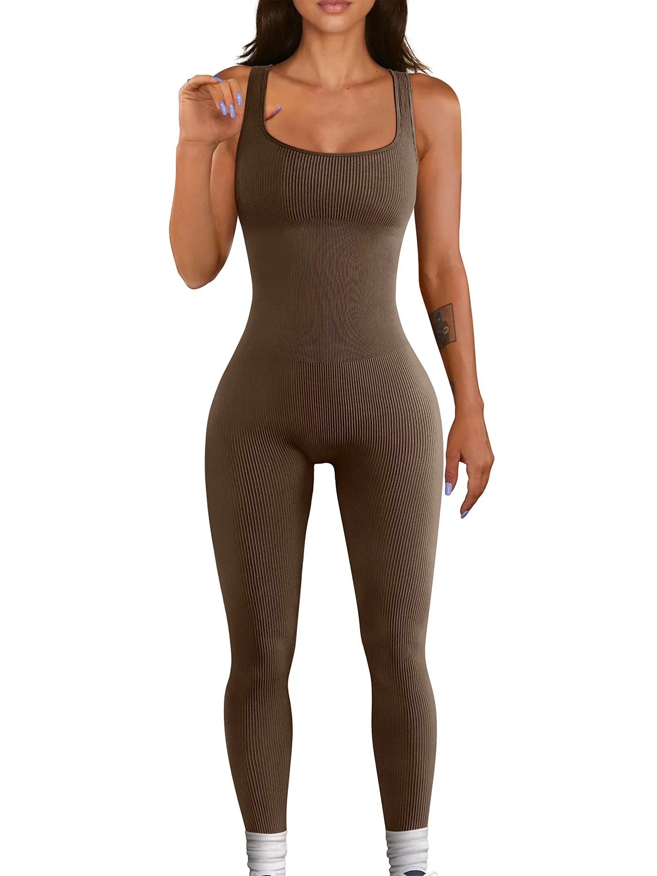 Women's beige suspender tank top tights with button detailing and long sleeves made from spandex fabric.