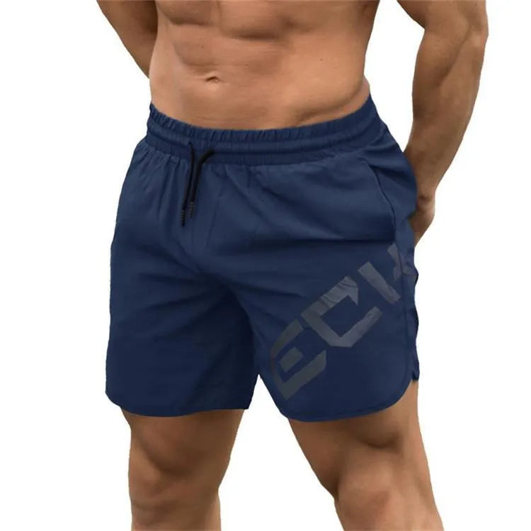 Man wearing black knee-length nylon running shorts during summer training.