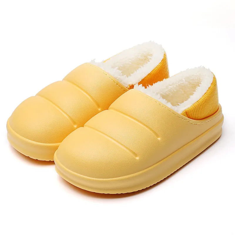 Women's green waterproof EVA winter slippers with plush lining and a non-slip sole.