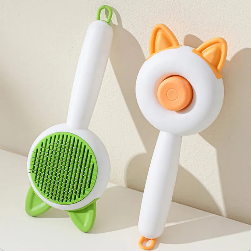 Self-cleaning pet grooming brush for cats with stainless steel teeth in greenish white colour