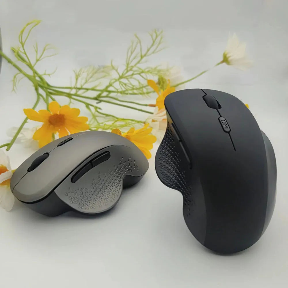 Grey and black wireless optical mouse for laptops with USB charging cable