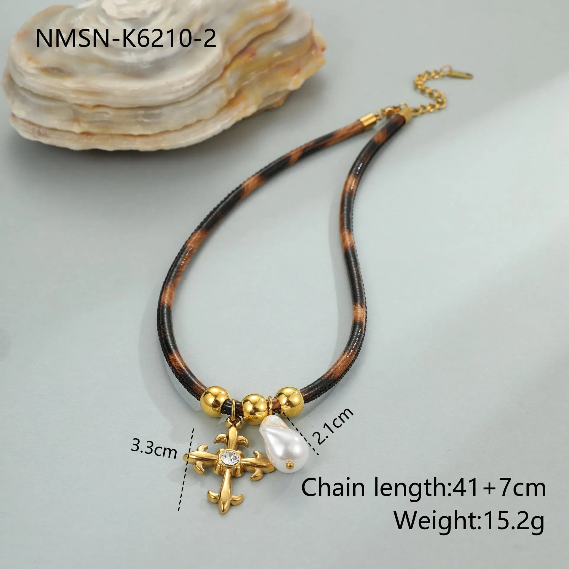 Geometric leopard print pendant on a stainless steel necklace chain with gold electroplated finish.