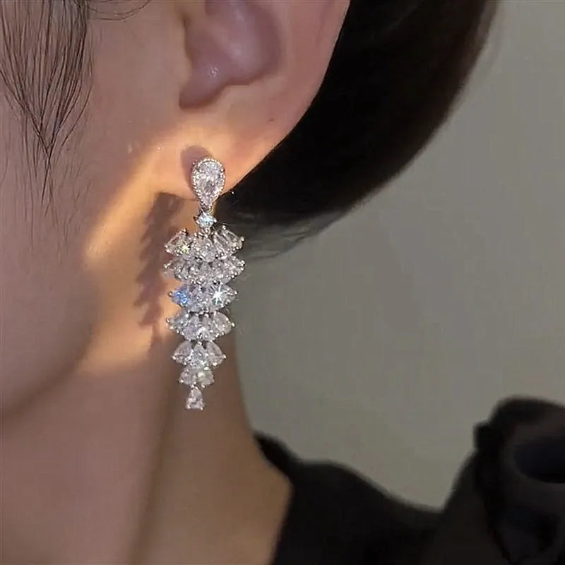Silver pagoda Christmas tree drop earrings with sparkling zircon stones and copper construction