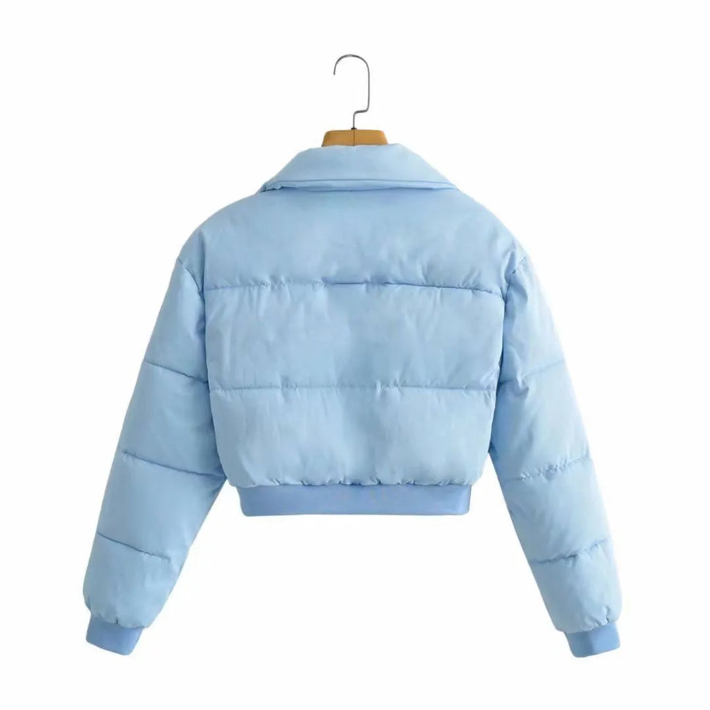 Women's loose blue polyester jacket with long sleeves shown front view