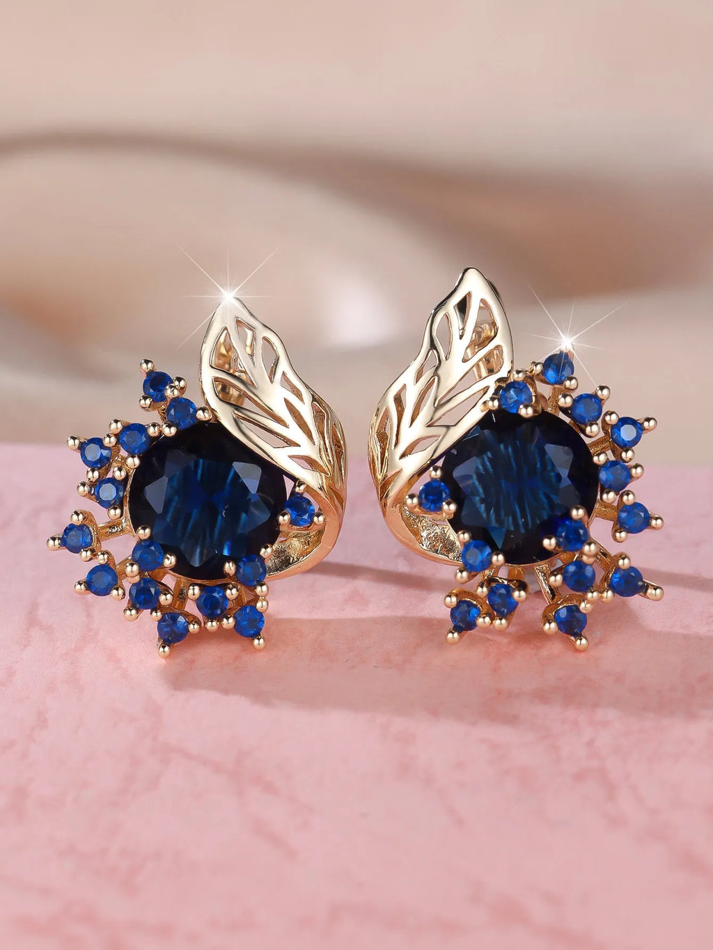 Round floral earrings with feather detailing and coloured zircon stones in champagne gold finish