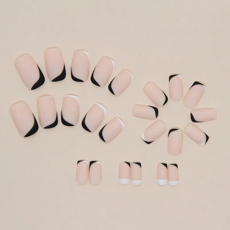 Black and white frosted artificial nail set for French manicures.