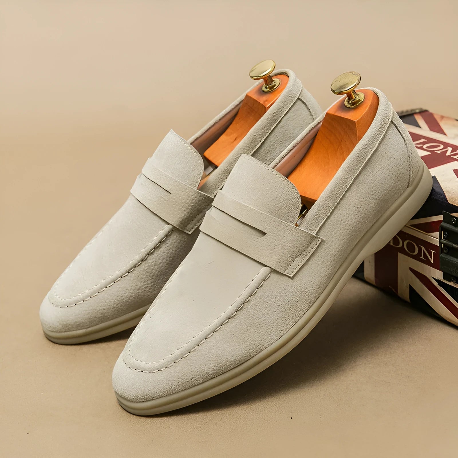 Men's beige leather slip-on shoes with round toe and rubber sole