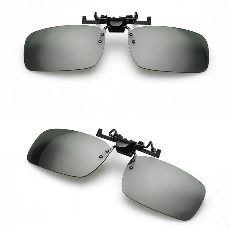 A pair of polycarbonate clip-on sunglasses for prescription glasses, shown in a dark green tint.