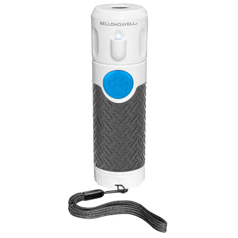 White handheld ultrasonic dog bark control trainer on a plain background
