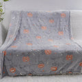 Children's flannel blanket with cartoon design used as air conditioner cover
