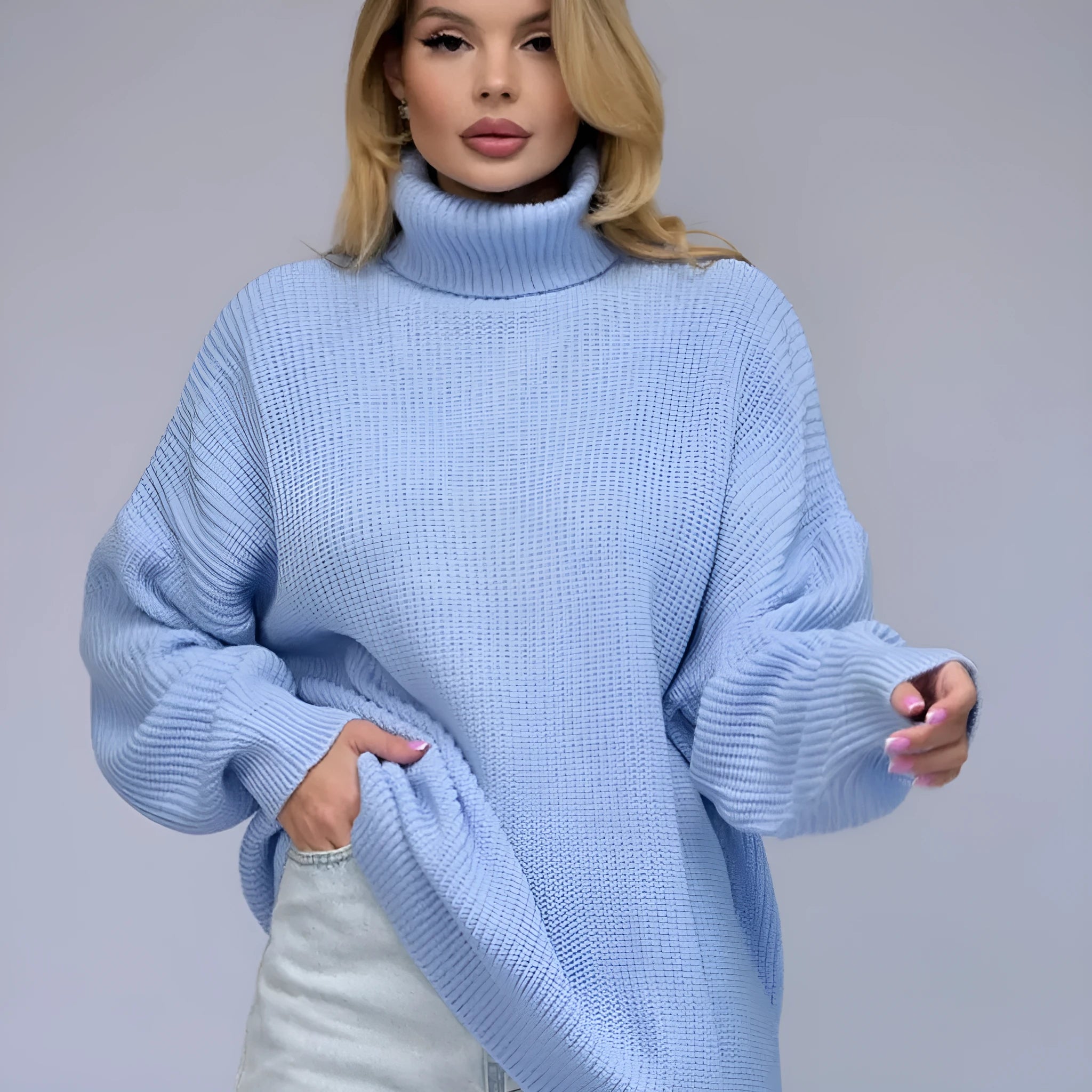 Women's solid colour high neck loose fit pullover sweater on a hanger
