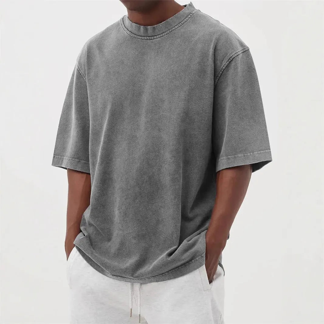 Men's distressed stone wash pullover T-shirt in loose fit with half sleeves available in multiple solid colours