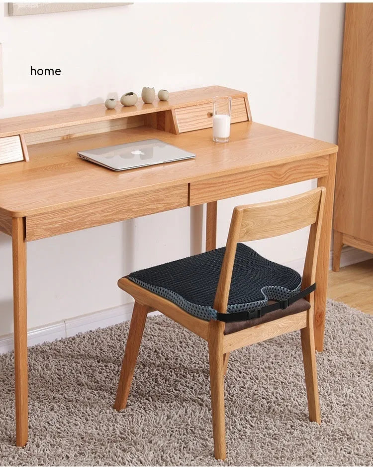 Regular size memory foam seat cushion with a black strap, shown in a creamy white solid colour.