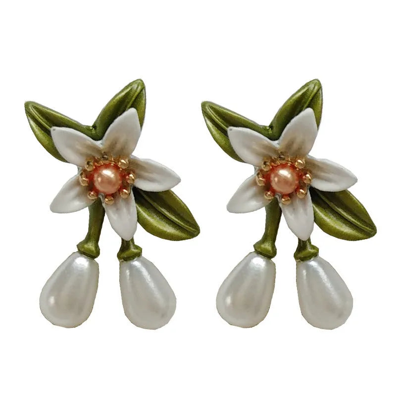 Women's flower ear clip earrings with sterling silver needle flowers and contrast colour alloy metal design