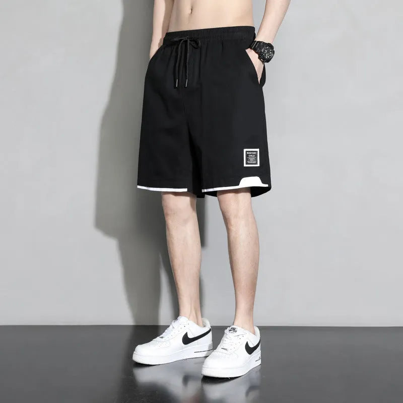 Boys' loose-fit cotton shorts in black, available in plus sizes for summer comfort.