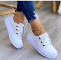 Women's white lace-up flats sneakers with rivet decoration and round toe design