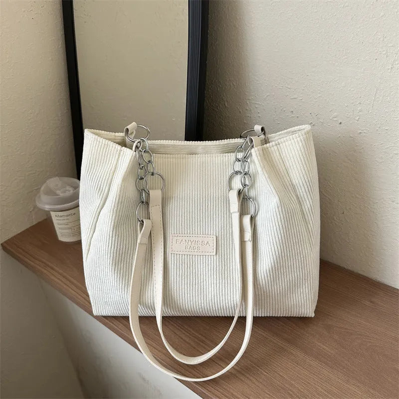 Corduroy one-shoulder tote handbag in street style with three-dimensional pocket