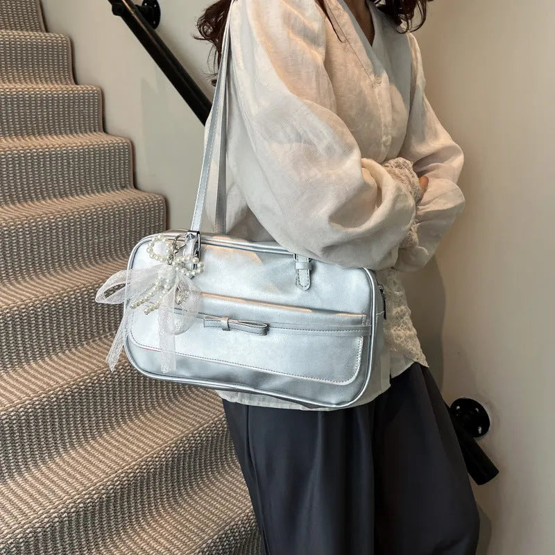 Women's black PU leather single shoulder flap bag with horizontal square shape and bow detail