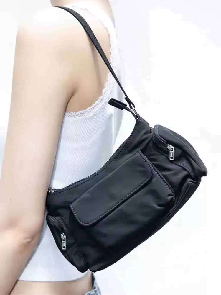 Simple black lightweight nylon shoulder bag with two front pockets