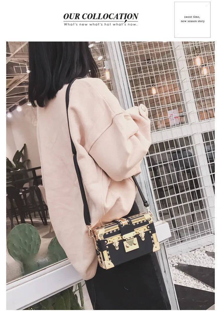 Women's black PU leather shoulder bag with flap closure and decorative rivets