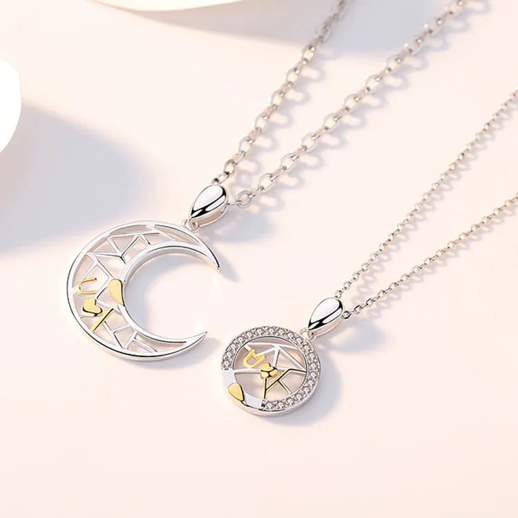 Sun Moon couple necklace set with copper electroplated pendants on a cross chain.