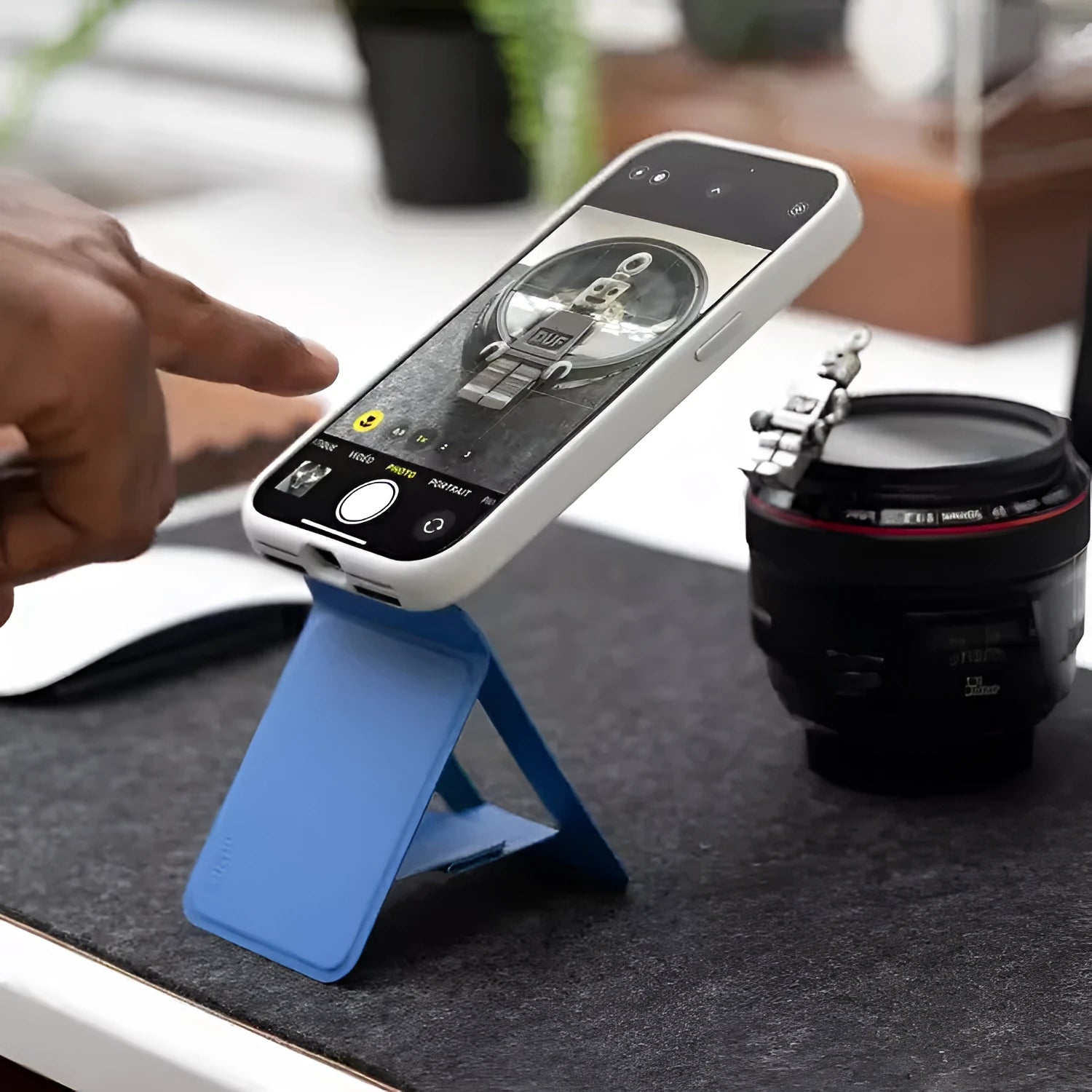 Black magnetic mobile phone holder with MOVAS leather finish, shown from the front.
