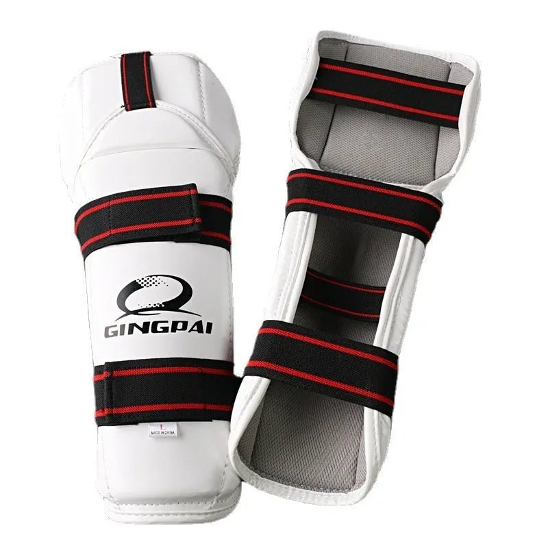 Taekwondo protective gear set showing arm guards, elbow guards, and leg protectors in multiple sizes