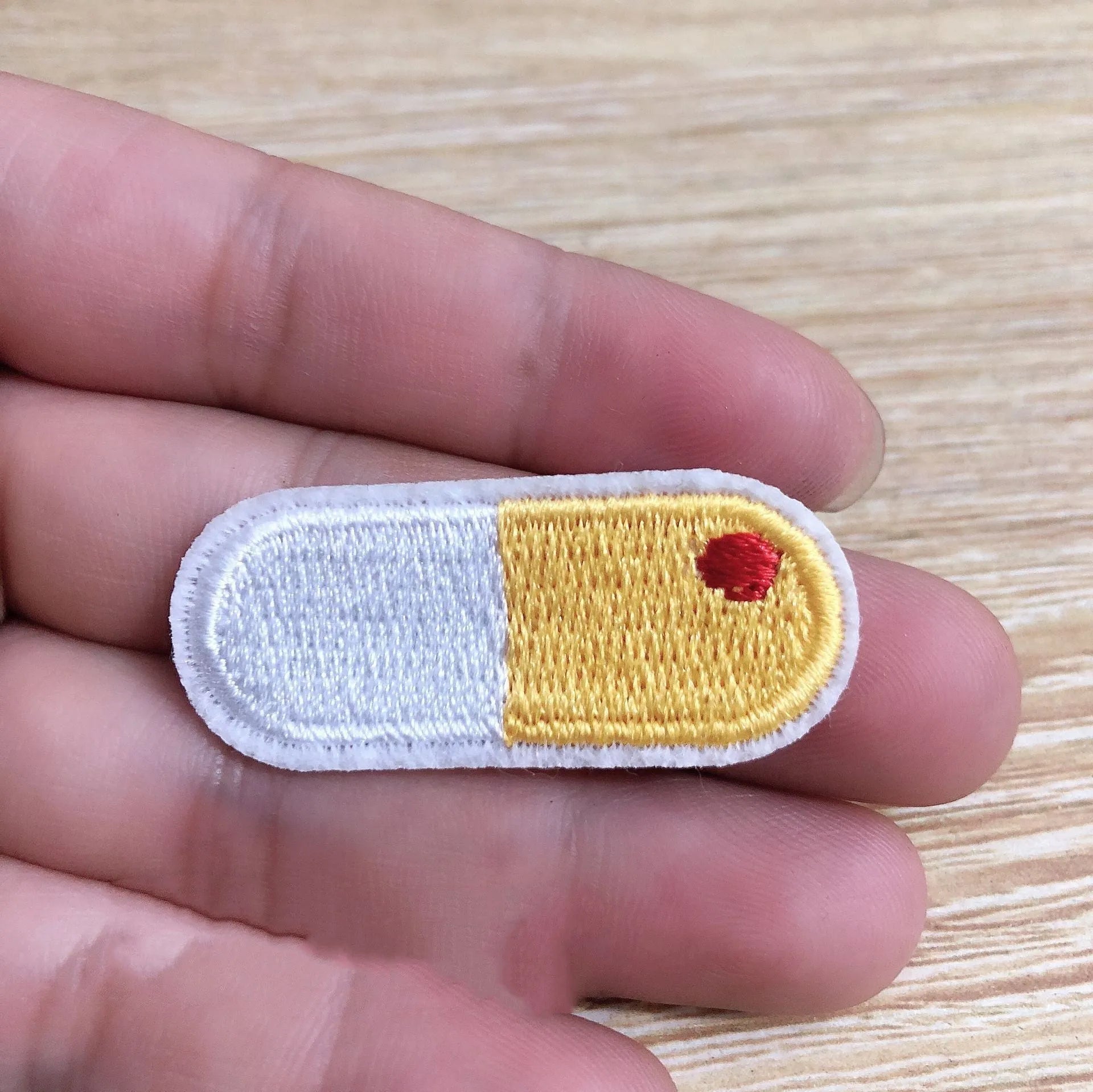 Ten embroidered cloth patches with lace edges for clothing decoration on fabric background