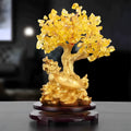 Citrine-coloured Chinese style resin turtle money tree ornament on display.