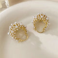 Gold women's flower basket earrings with pearl bead decoration on copper